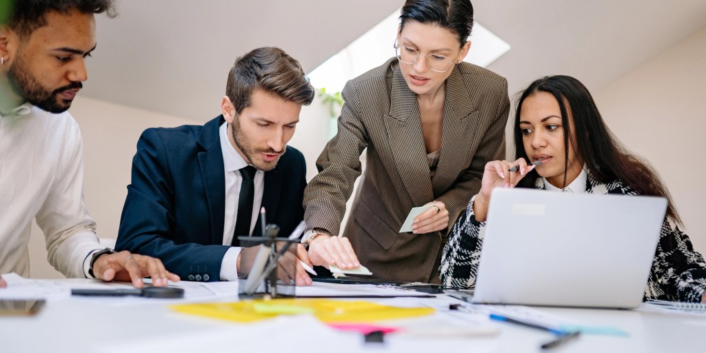 Employees reviewing reports