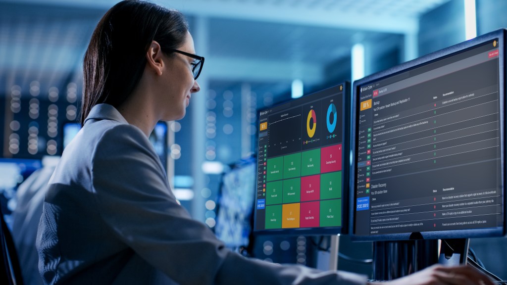 Female IT Engineer Working in Monitoring Room.