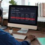 Man at desktop reviewing user access dashboard