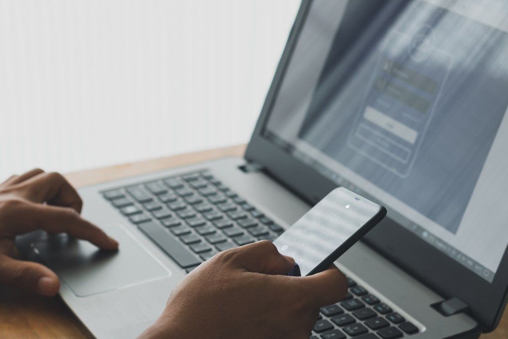 A person using MFA to log onto computer